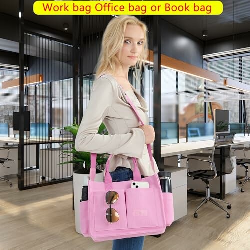 Woman in office holding a pink tote bag